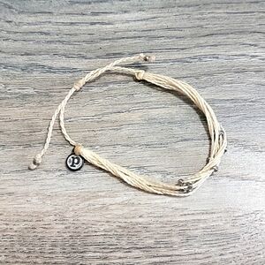 NWOT Cream Pura Vida Bracelet with silver beads